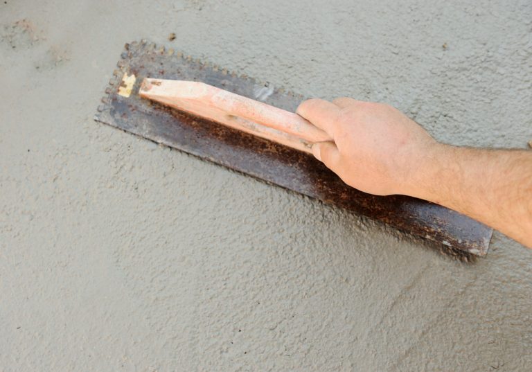 pouring concrete over asphalt